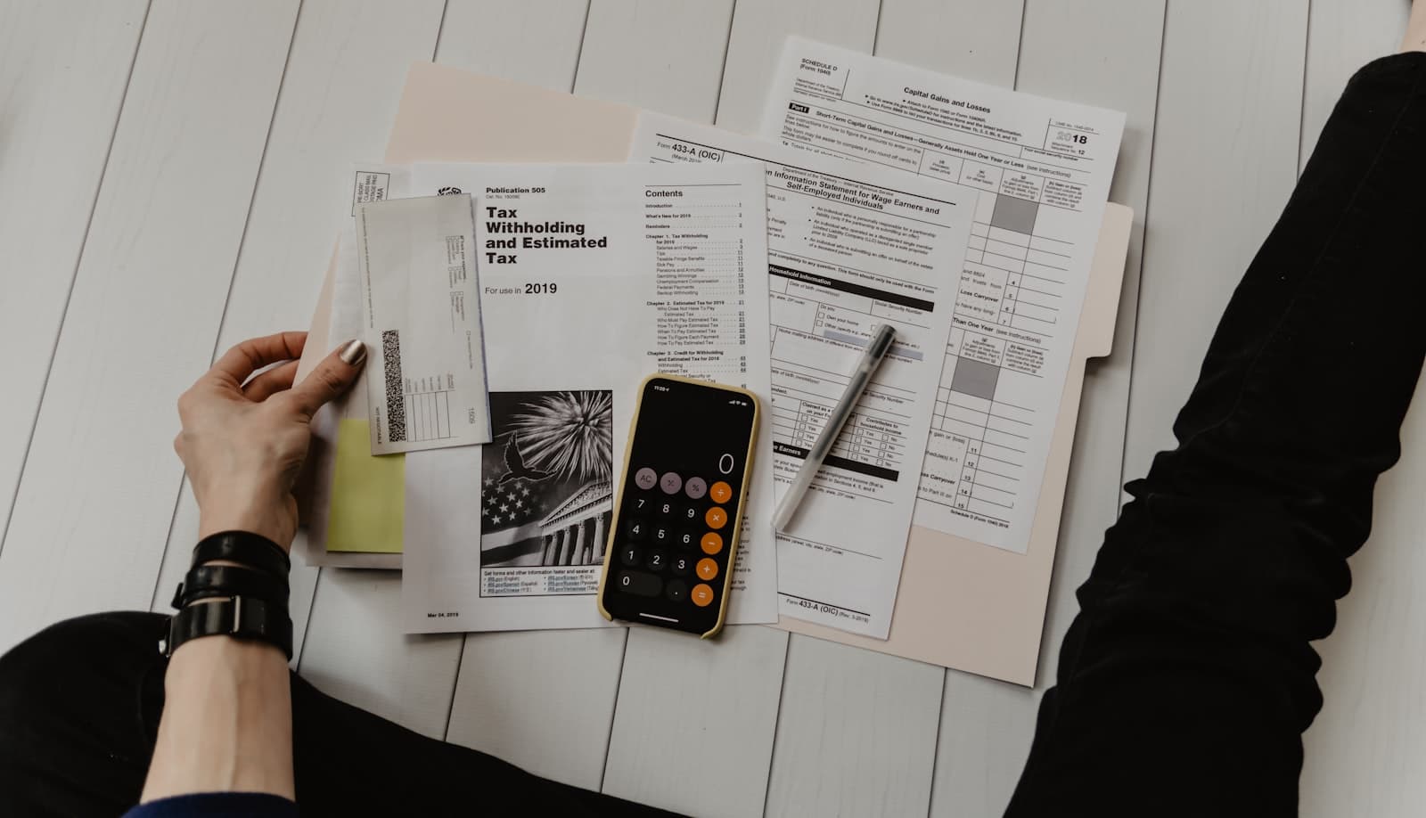 Financial analyst reviewing charts and reports